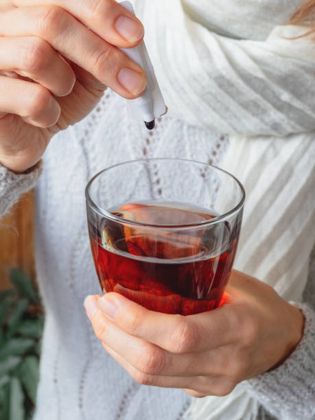istock Additive to a drink. Plastic ampoule with medicine or vaccine. Modern medicine concept. Complex of humic and fulvic acids promotes adaptation to active life after illness and restores the balance. 1368665614