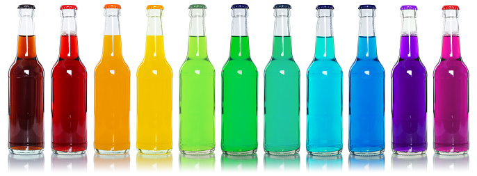 Drinks lemonade cola drink many softdrinks bottles in a row isolated on a white background