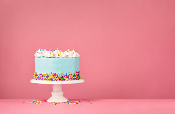istock Blue Birthday Cake on Pink Background 1368666288