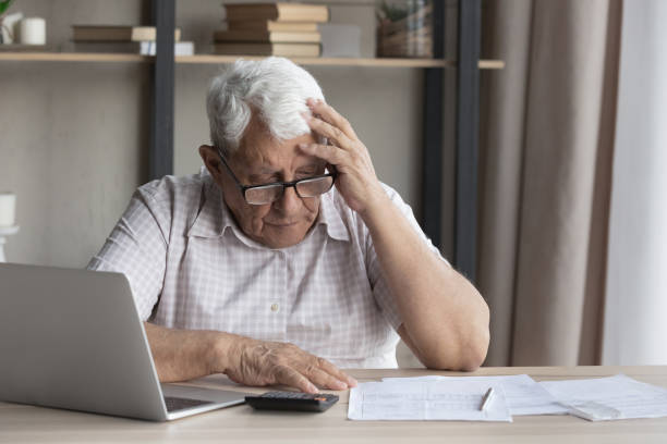 istock Confused stressed old mature retired 80s man having financial problems. 1368666489