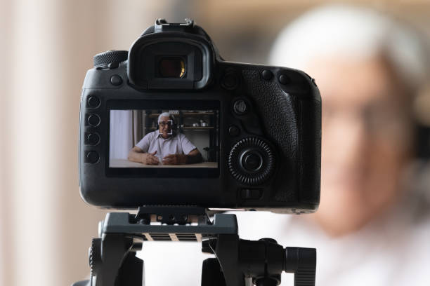 istock Confident older generation retired man recording educational video. 1368666498