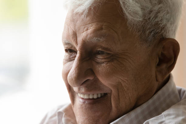 istock Close up happy old man looking in distance. 1368666506