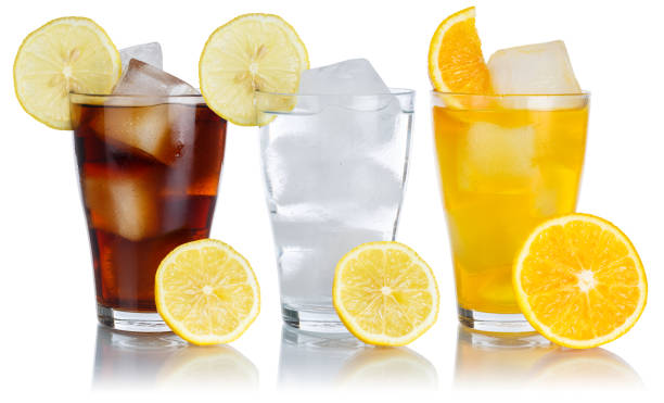 istock Drinks lemonade cola drink softdrinks glass in a row with lemon isolated on white 1368666681