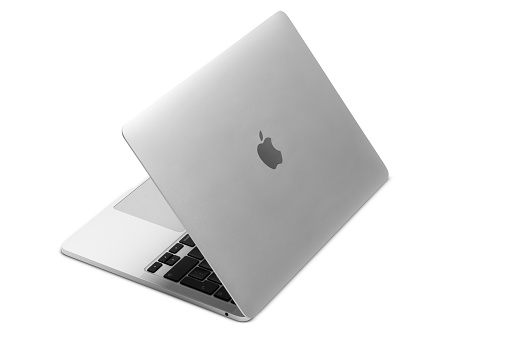 Izmir, Turkey - January 10, 2022: Half opened Apple Brand M1 Model Macbook pro laptop computer on a white background