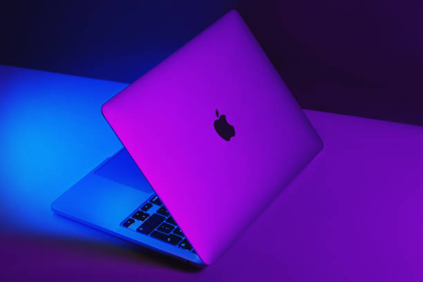 Close-up of apple kept on laptop