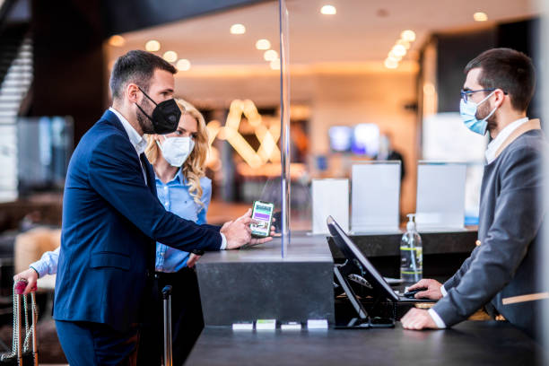 istock Hotel check-in during Covid 19 pandemic 1368669654