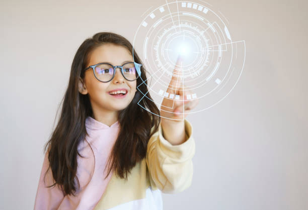 istock Cute little girl touching the digital touch screen with big data network connection 1368676634