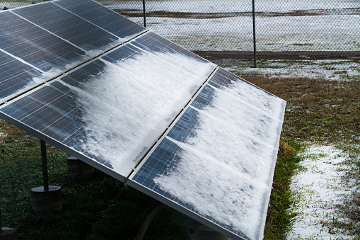 Solar Panels covered in Snow during Winter Storm in Austin , Texas ,USA