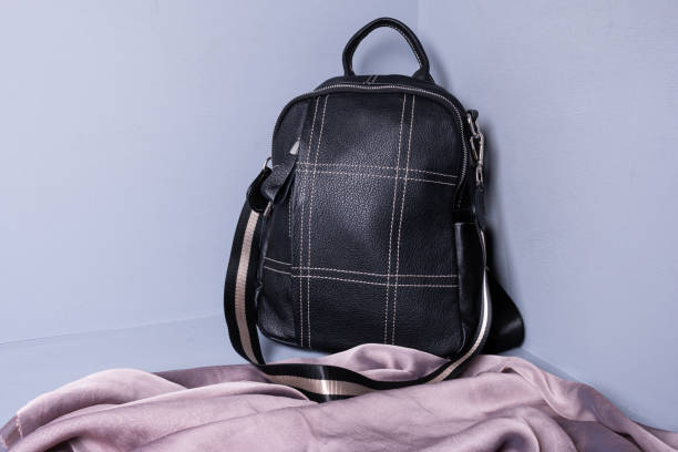 istock Black women's backpack with decorative white stitching. Backpack bag with wide shoulder strap 1368682124