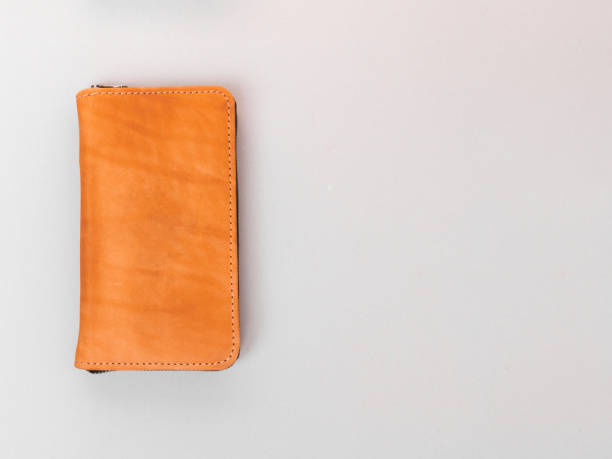 istock Brown wallet made of genuine leather on a gray background 1368682746