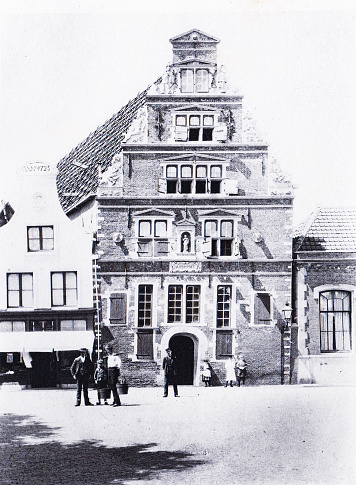 Saint Jan's Gasthuis, built in 1563, served as a hospital until 1841 in Hoorn, Netherlands. At one time it was also a butter market. John the Baptist statue is on the front of the building. Photo by Dr. Charles Mitchell commissioned for an 1894 book about Holland. Source: Original edition is from my own archives. Copyright has expired and is in Public Domain.