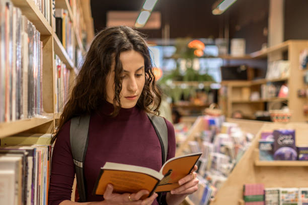 istock A smiling Brazilian woman holds a book 1368691114