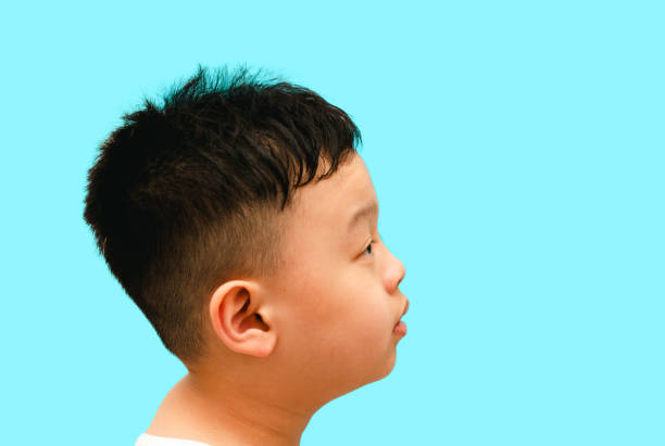 istock boy child look away portrait headshot 1368691127