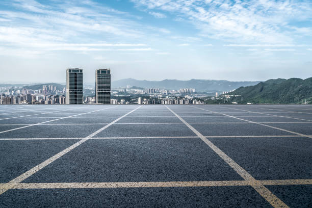 istock Asphalt ground lines and city buildings 1368694809