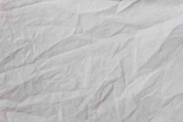 istock Wrinkled sheet. White fabric close-up. Burlap texture. Sheet on the bed. 1368699368
