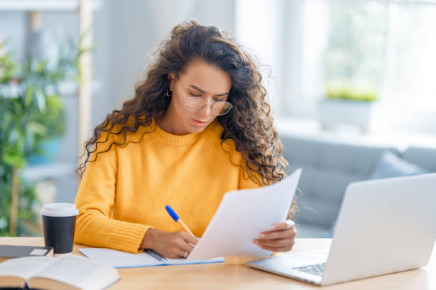 istock woman working on laptop at home. 1368699936