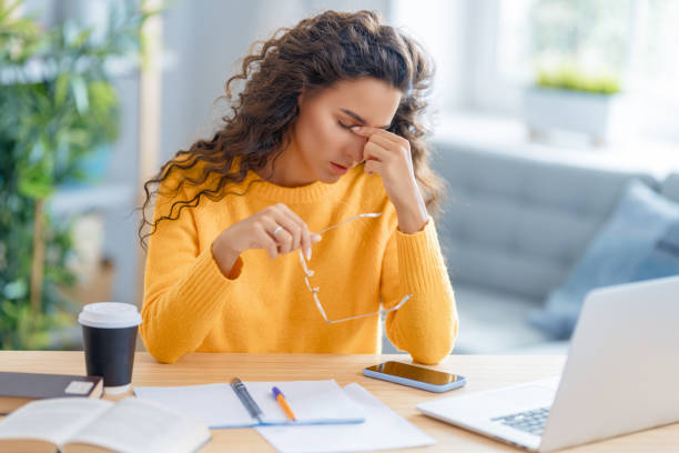 istock Young woman studying and having a head ache 1368699977