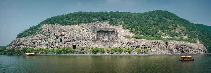 Panoramic view of The Longmen Grottoes and The Yi River at Luoyang, Henan, China