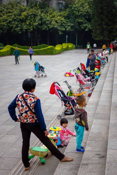 Grandmas and children in a Chinese park stock photo