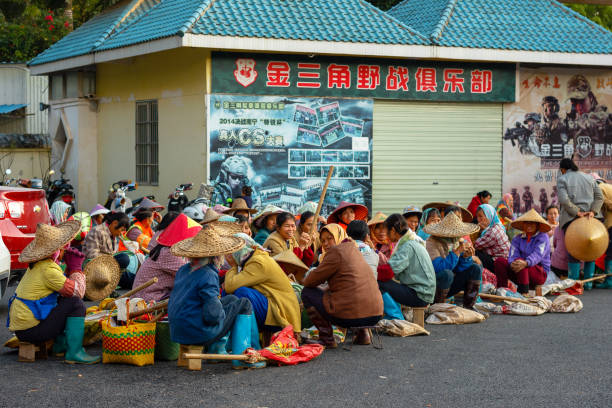 Public gardeners resting on lunch break in Shimen Forest Park (石门森林公园) in Nanning, Guangxi Zhuang Autonomous Region, China