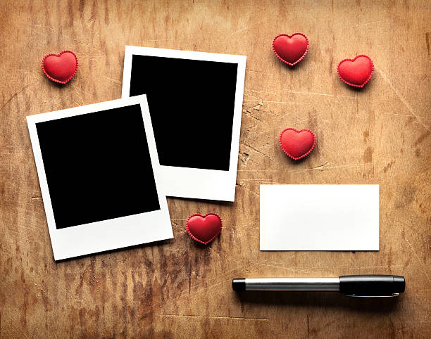istock Blank picture frames with hearts and love message on wood. 136870767
