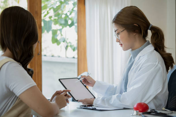 istock Doctor holding digital tablet explaining, discussing medical checkup result with patient. 1368709280