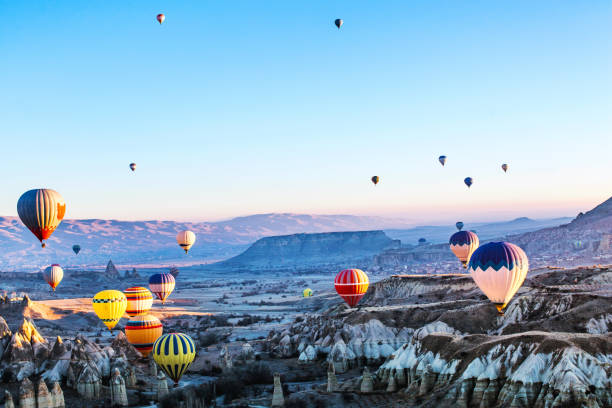 istock Hot air balloons accending to the sky 1368712995