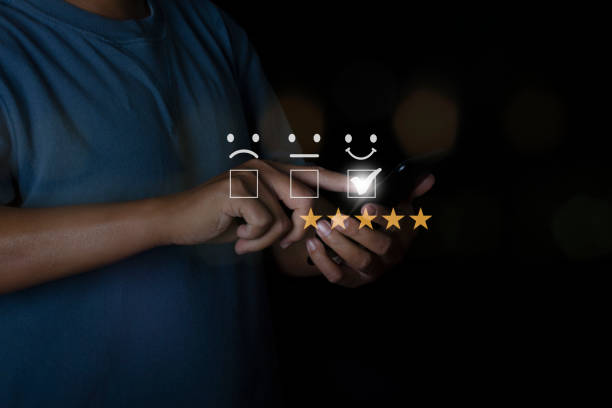 istock Businessman use smartphone choosing screen on five star icon to give satisfaction in service rating very impressed. Customer service experience. 1368715317