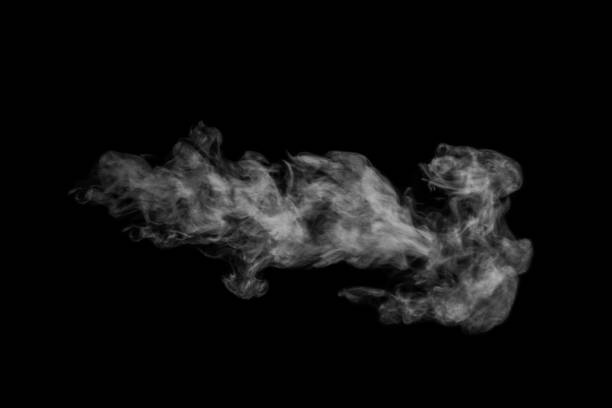 istock Horizontal mystical curly white steam or smoke isolated on black background. Abstract background fog or smog 1368716243