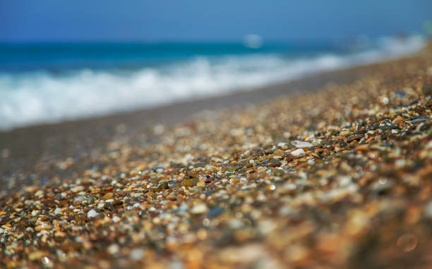 istock Pebbles on the beach by the sea. Selective focus. 1368717232