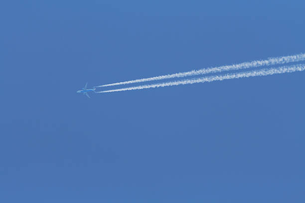 istock aeroplane in flight with vapour trails 136871856