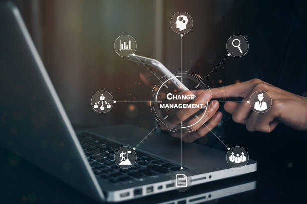 istock Businesswoman using phone in office document Change management in organization and business concept with consultant presenting icons of strategy. Organizational transition and transformation 1368719976