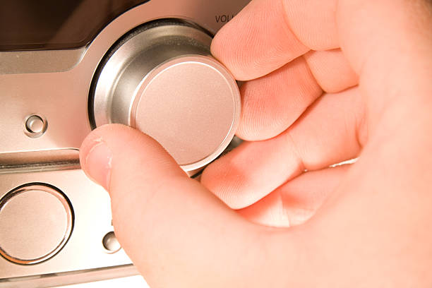 istock hi fi control with male hand 136872316