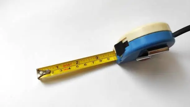 Blue roll meter measuring on white background