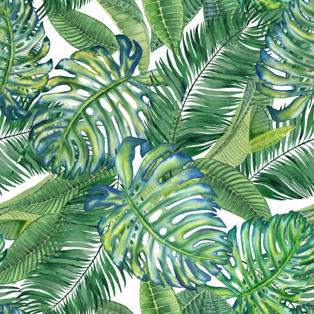 istock Tropical leaves seamless watercolor pattern. Hand drawn illustration of green plant branches isolated on white background. Jungle ornament. Summer print for clothes and wallpaper. Exotic background. 1368729654
