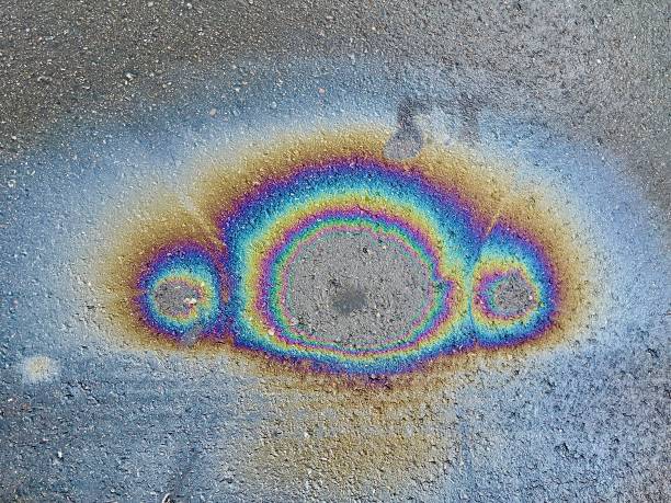 istock Eco concept, oil spill on asphalt road 1368732096