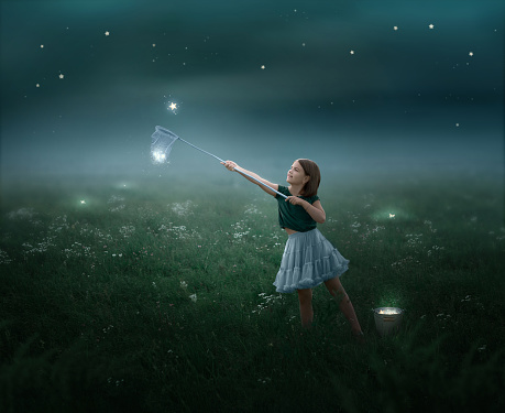 The girl catches stars in the sap at night and puts them in a bucket in the field.