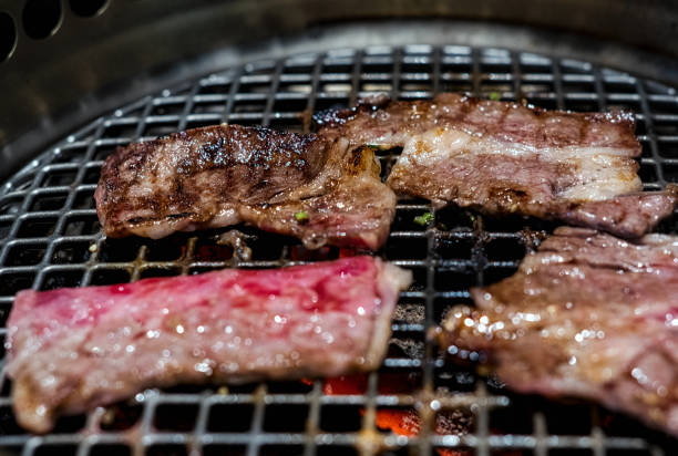 istock Raw beef slice on grille for barbecue or Japanese style yakiniku 1368736800