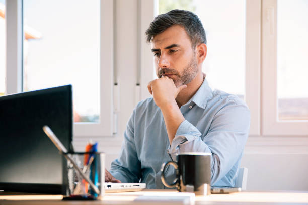 istock Businessman working from home with laptop 1368740531