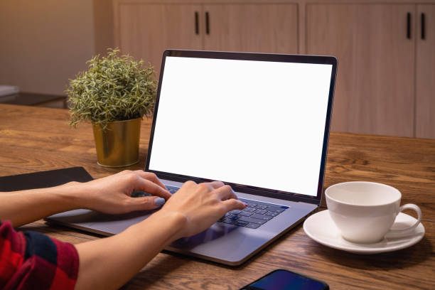 istock Woman working on laptop with white screen. Work from home. 1368741692