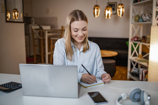 istock Cheerful woman working from home 1368748596
