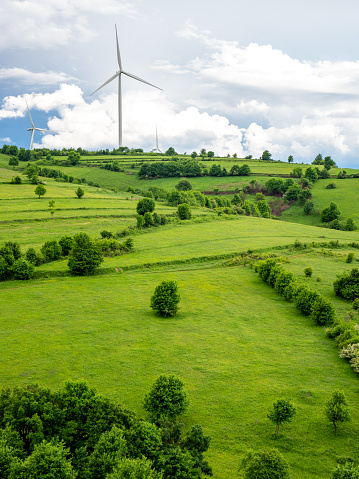 wind turbines on hills in romania, near moldova noua, near danube bank