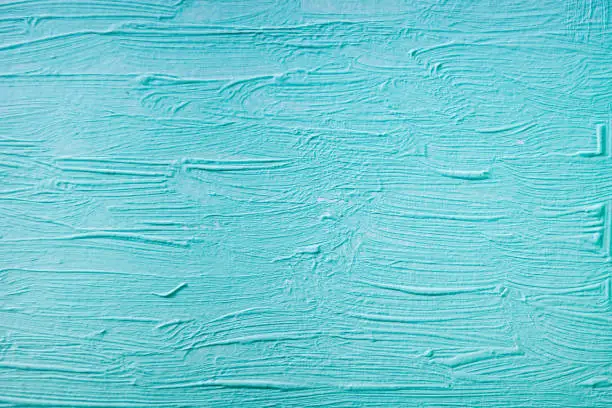 Photo of Blue paint texture on a canvas surface, as a background