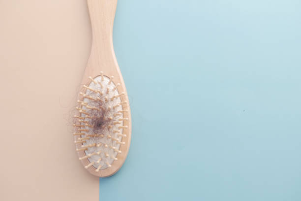 istock a brush with lost hair on table , top down 1368757368