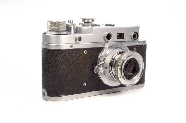 istock Old film camera isolated on white background. 1368757690