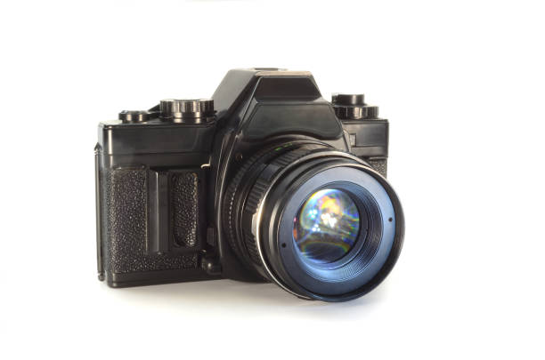 istock Old film camera isolated on white background. 1368757718