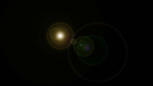 Yellow lens flare light on black background