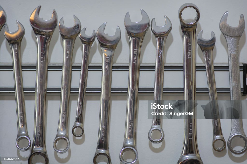 Wrench tool set, made of steel, hanging on wall in a workshop Work Tool Stock Photo