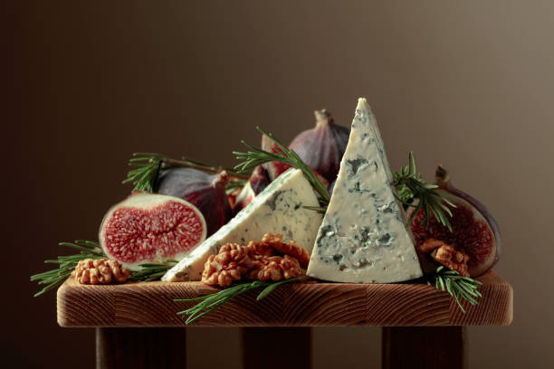 istock Blue cheese with figs, walnuts, and rosemary. 1368759849