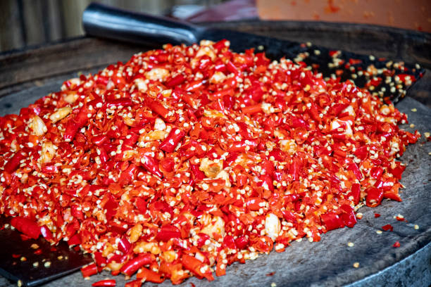 istock Chopped cayenne peppers and garlic in a wok 1368767749